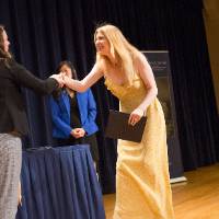Emily shaking hands with Olivia Witsaman